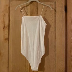 White body suit, never worn. Size medium.